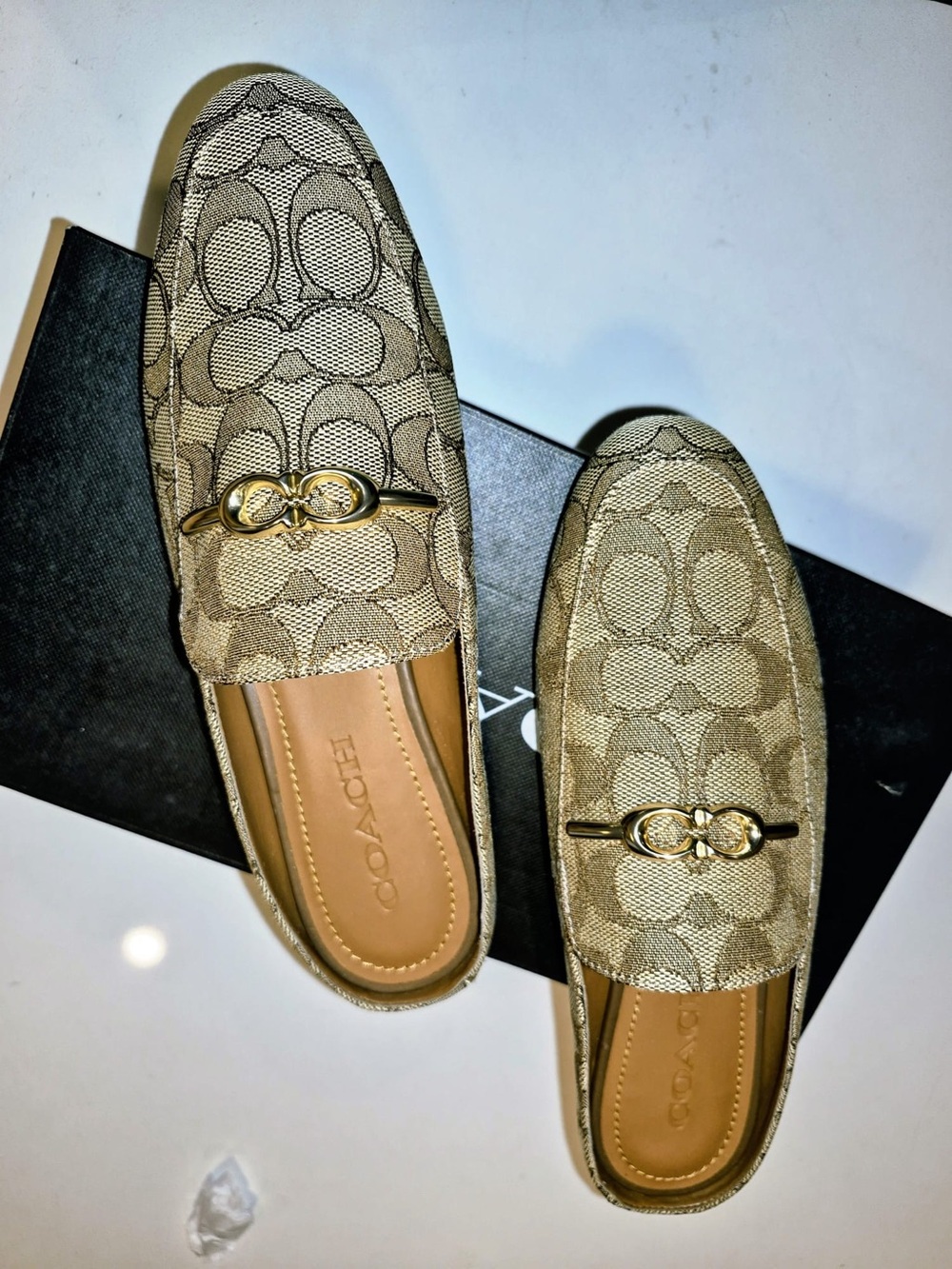 Coach womenโs Khaki Signature Canvas Slip-On Loafers with Gold Accent